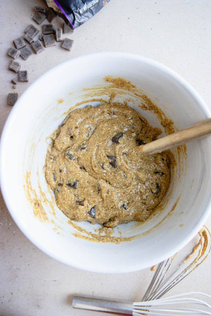 dark chocolate chunks added to olive oil chocolate chip cookie dough batter