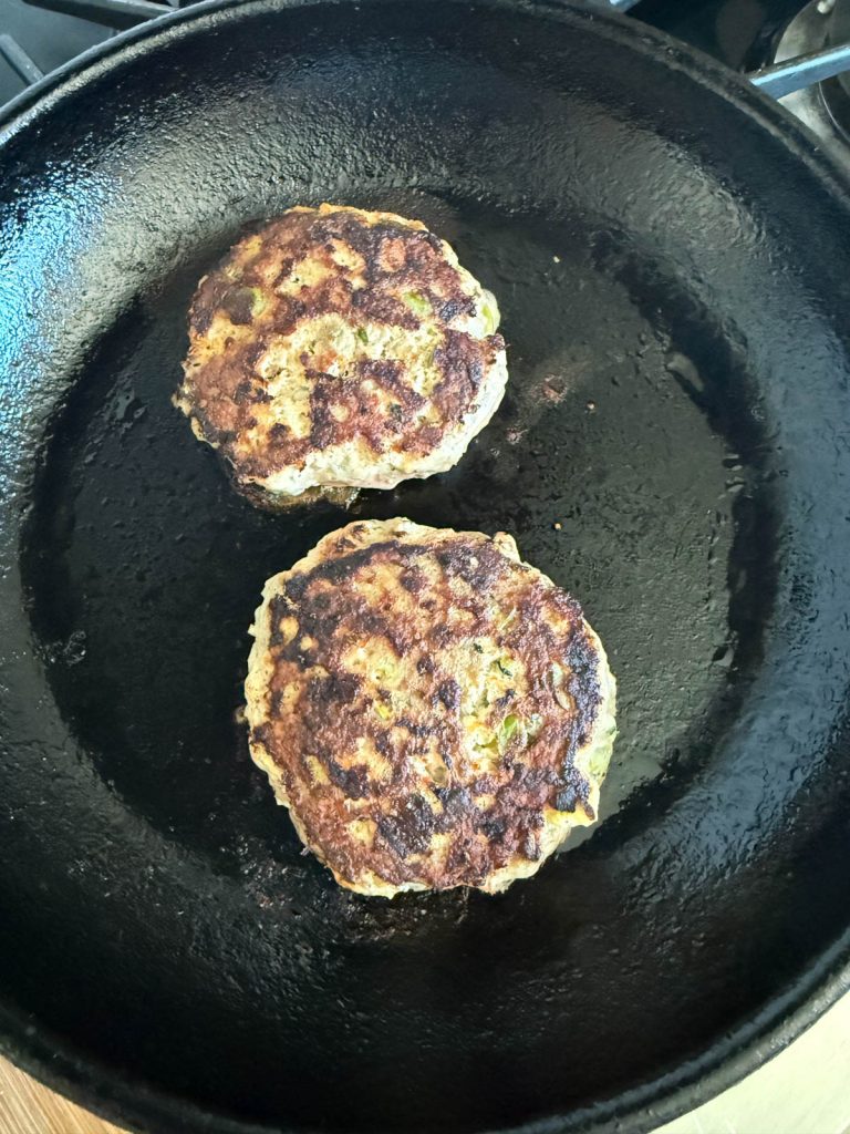 grilled turkey burgers cooked in a cast iron skillet 