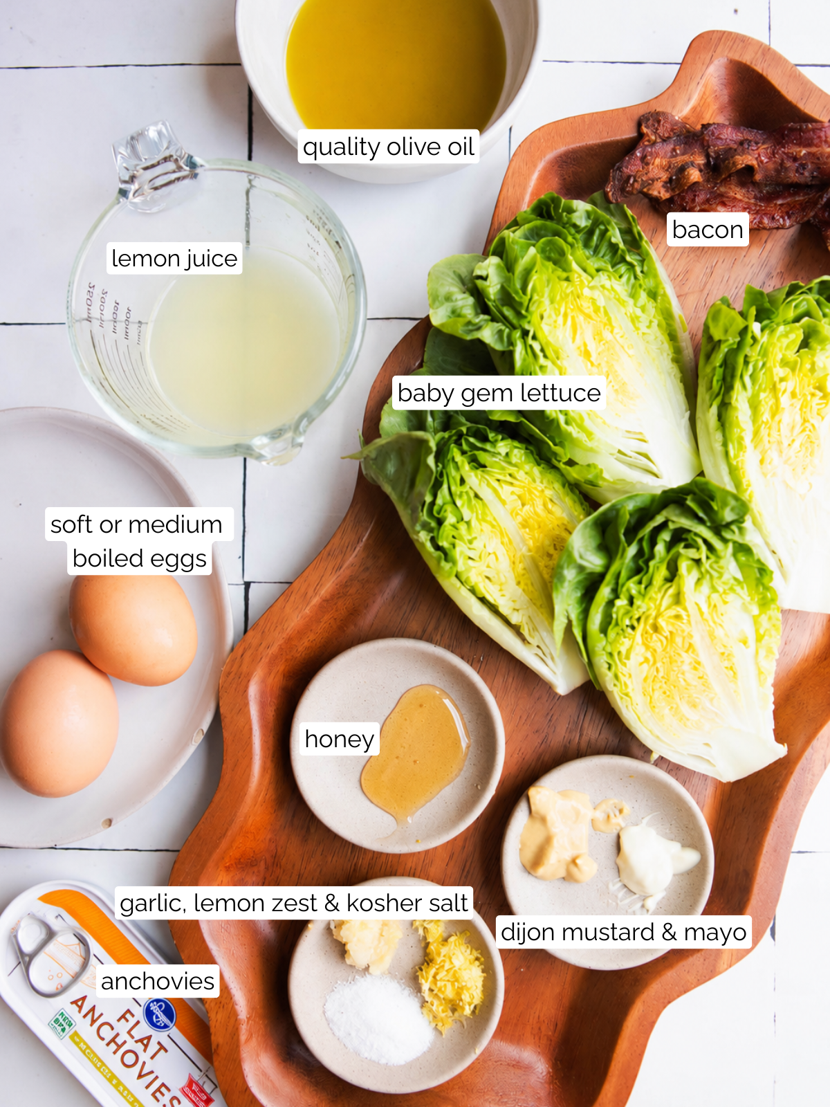 ingredients to make French bistro salad on a white backdrop