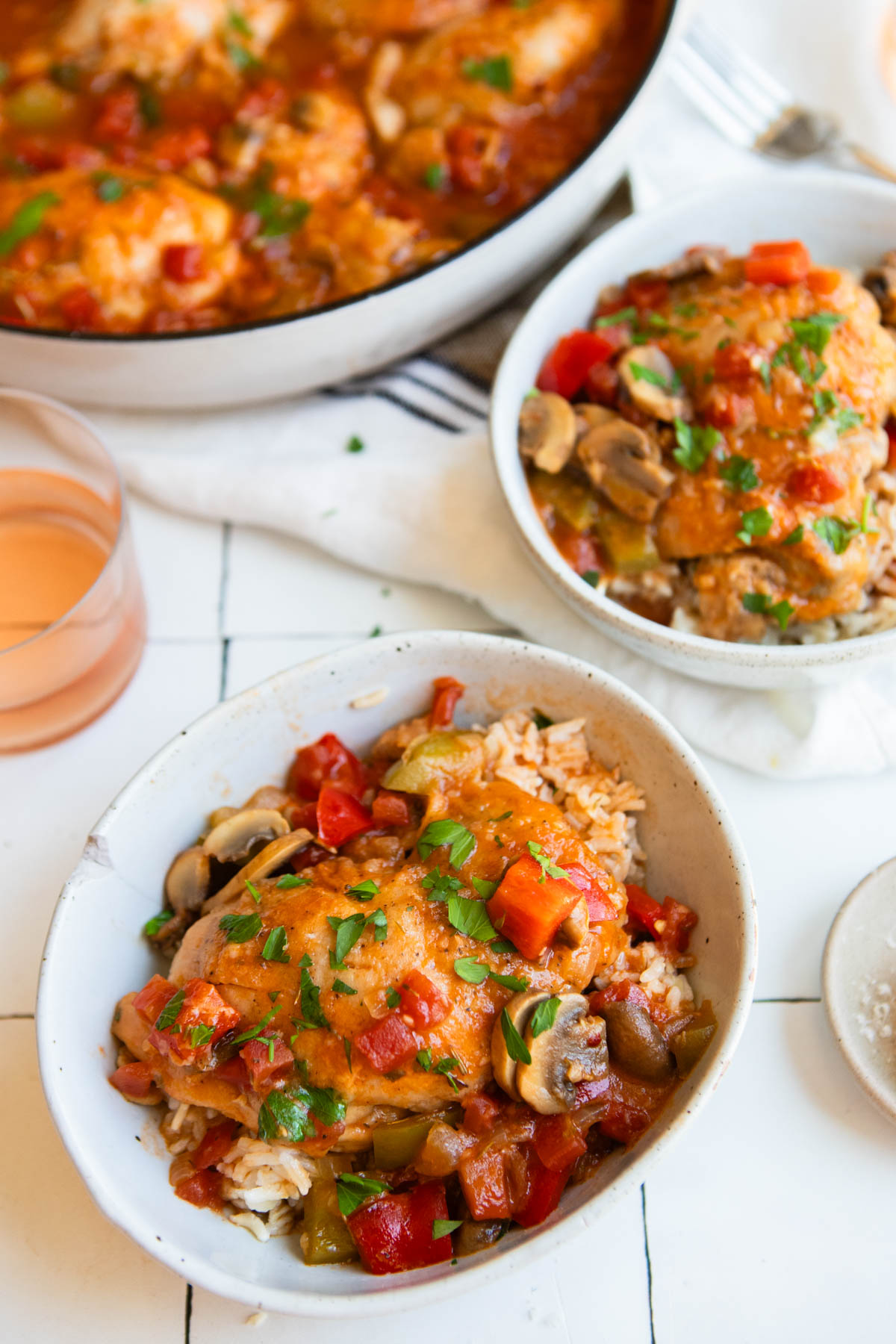 chicken cacciatore served over a bowl of brown rice
