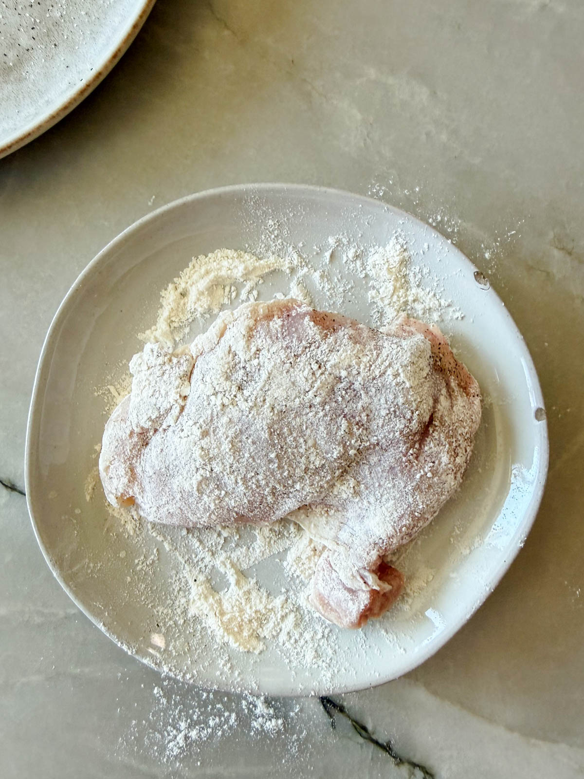 chicken thighs dredged in flour 