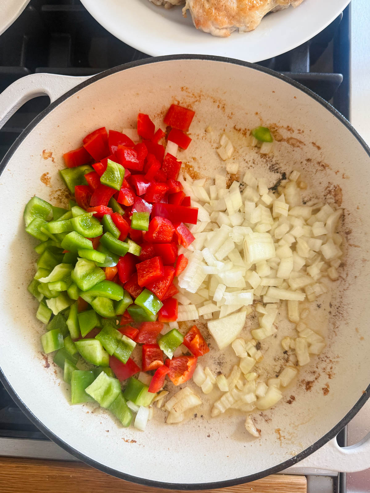 bell peppers and onions in a large sauté pan 