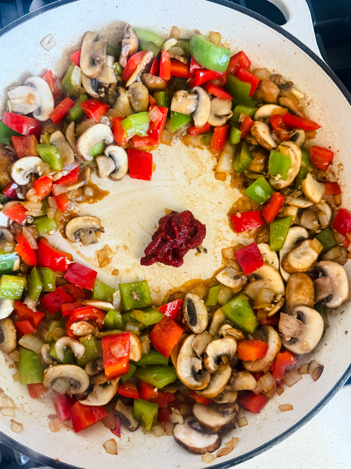 tomato paste added to saute pan