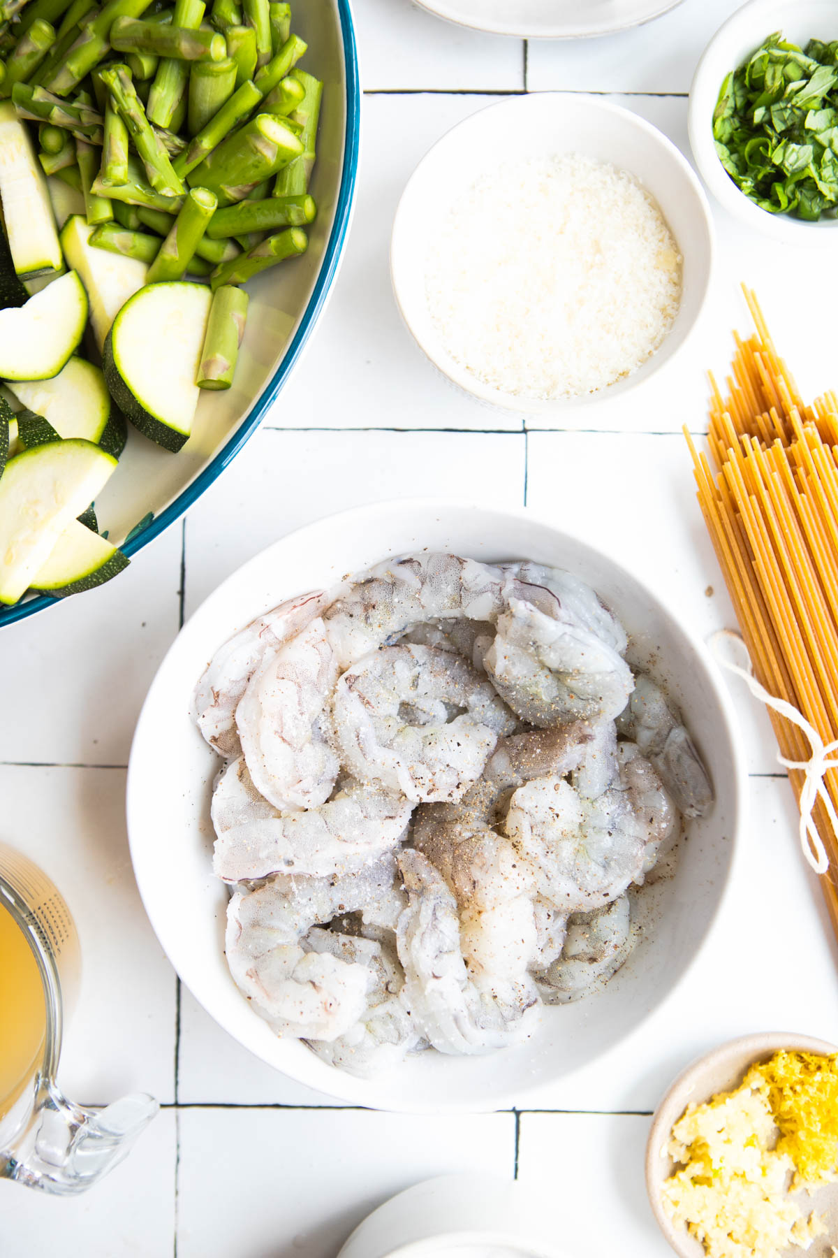 raw shrimp in a bowl and sprinkled with salt and pepper