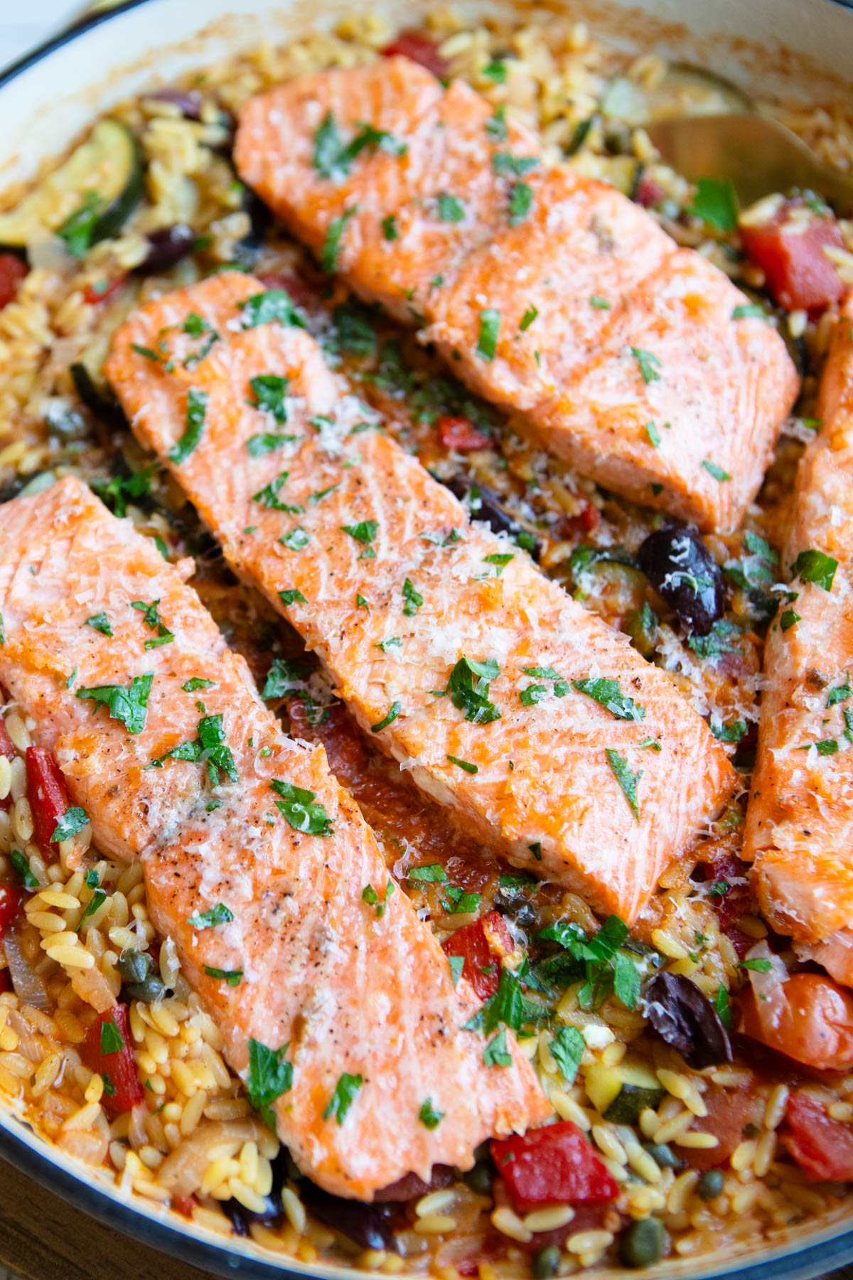 salmon filets cooked in one pan with orzo and vegetables