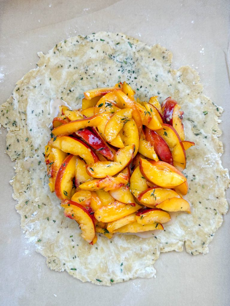 dough rolled out and peach filling placed in the center