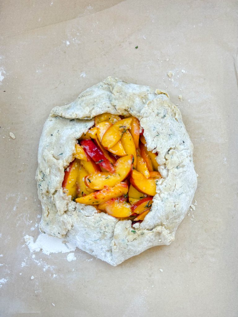 galette dough formed around peach filling