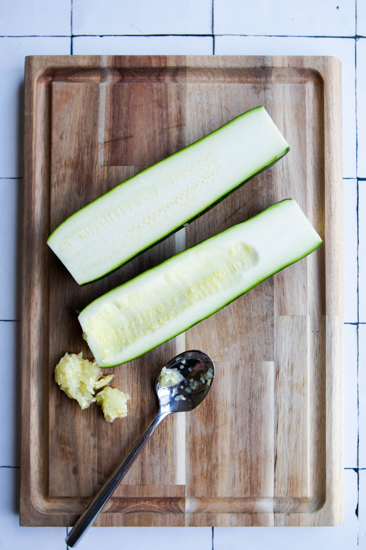 raw zucchini cut in half lengthwise and seeds scooped out