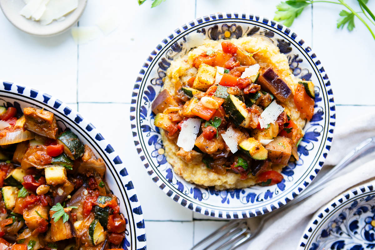 French ratatouille in a serving bow topped on creamy polenta
